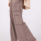 Knit Terry Mineral Wash Wide Leg Pants in soft fabric with trendy pockets and relaxed fit, paired with brown sandals.