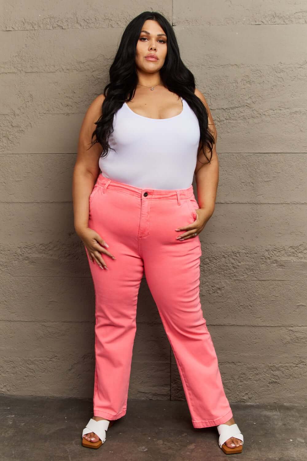 Woman wearing Kenya High Waist Side Twill Straight Jeans in pink, paired with a white tank top, exuding style and confidence