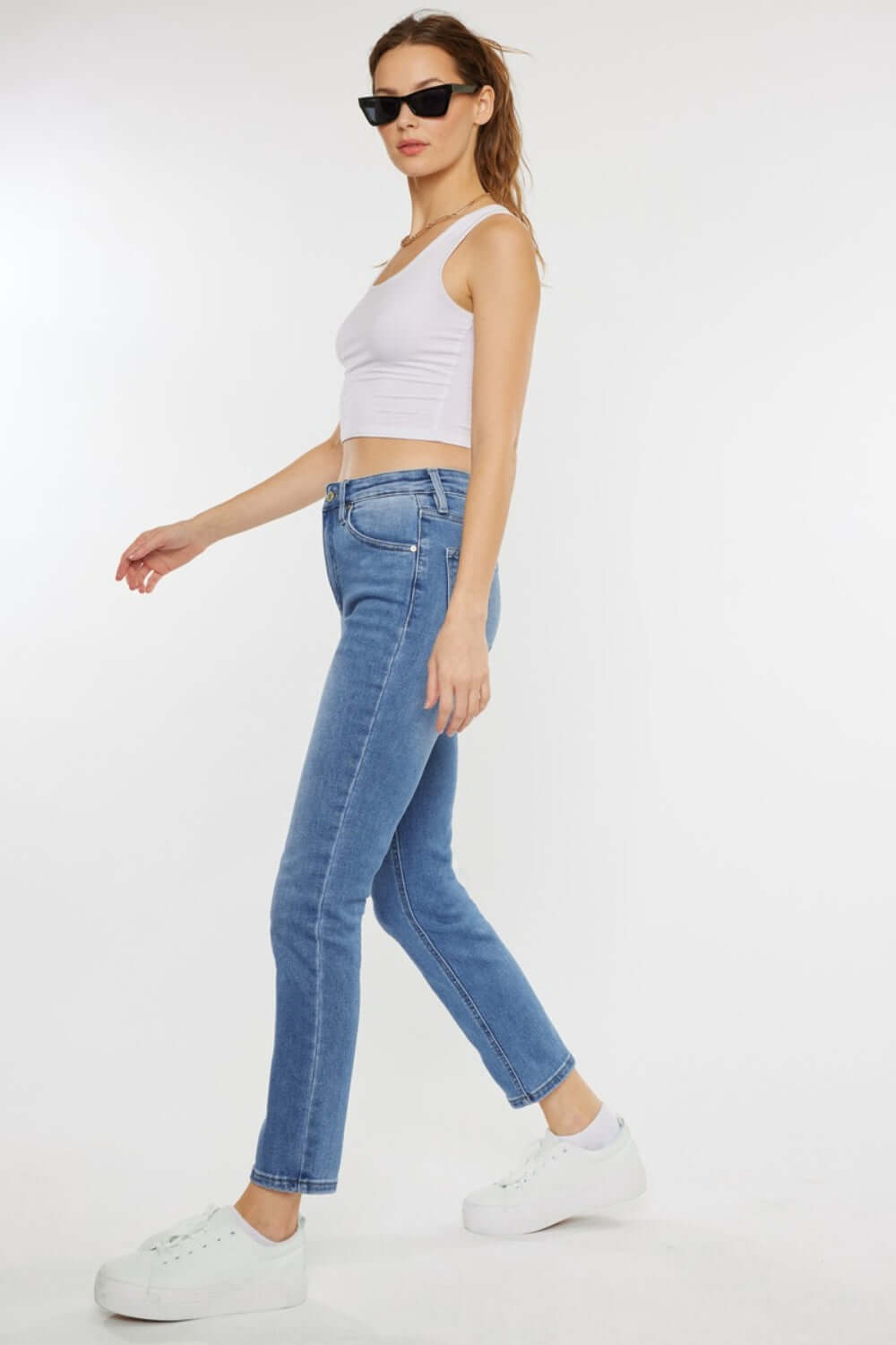 Model wearing Cat's Whiskers High Waist Jeans, showcasing a vintage charm and flattering high waist design with unique cat's whiskers detailing.