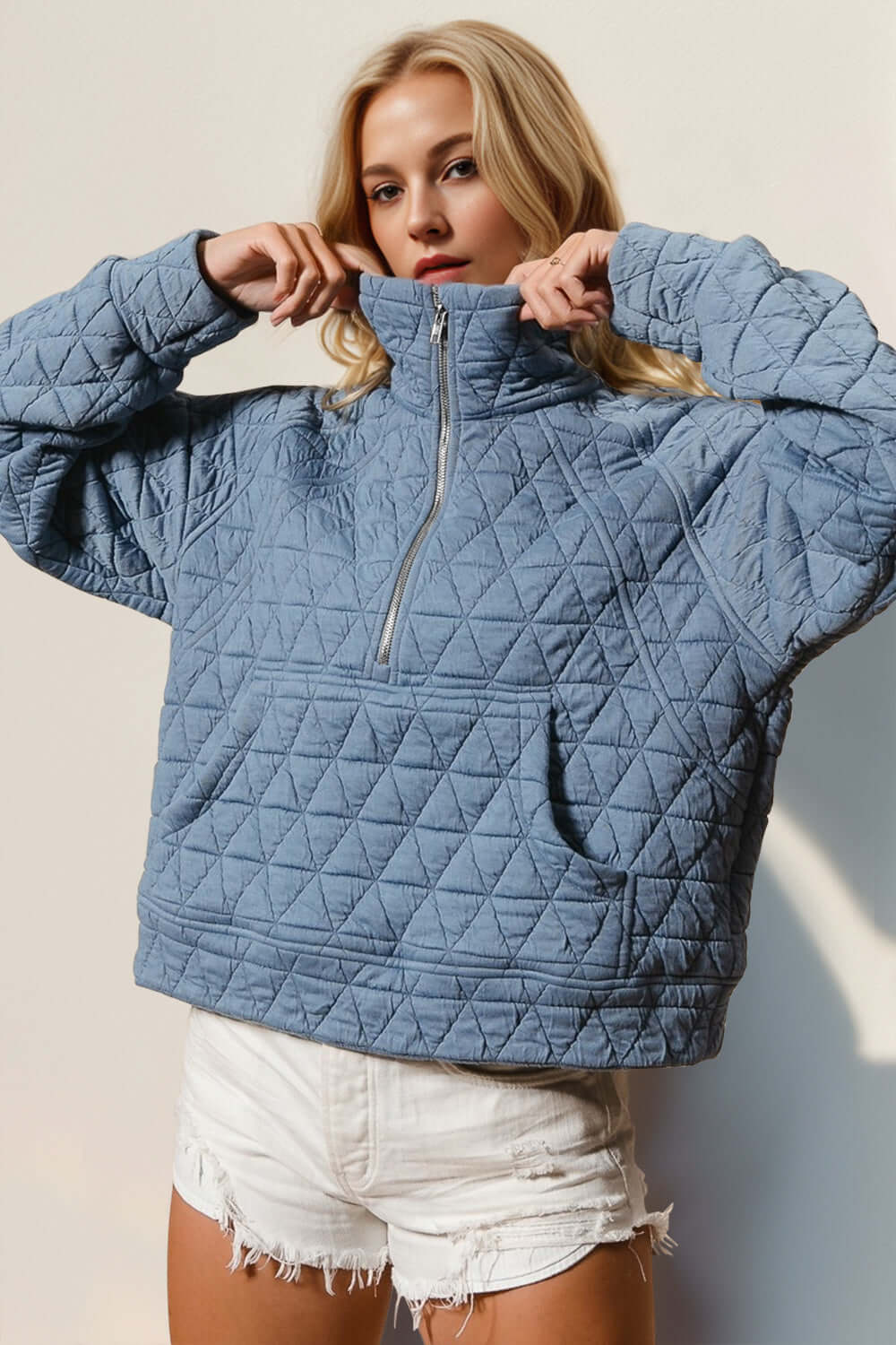 Stylish blue double take half zip quilted sweatshirt with pocket and long sleeves, perfect for cozy yet cool fashion.