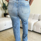 Back view of person wearing high waist wide leg Judy Blue jeans showcasing flattering fit and retro-chic style.