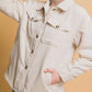 Woman wearing a Love Tree Corduroy Button Up Jacket with cozy sherpa lining, perfect for stylish warmth.