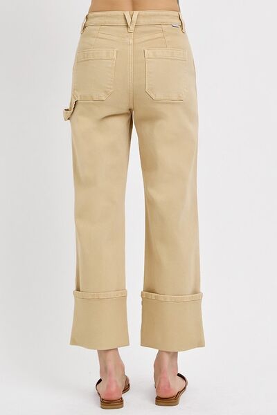 Back view of RISEN full size high rise wide straight cuffed patch jeans in beige with stylish cuffed bottoms.