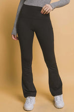 Black high waist flare leggings with side pockets, perfect for workouts and casual wear.