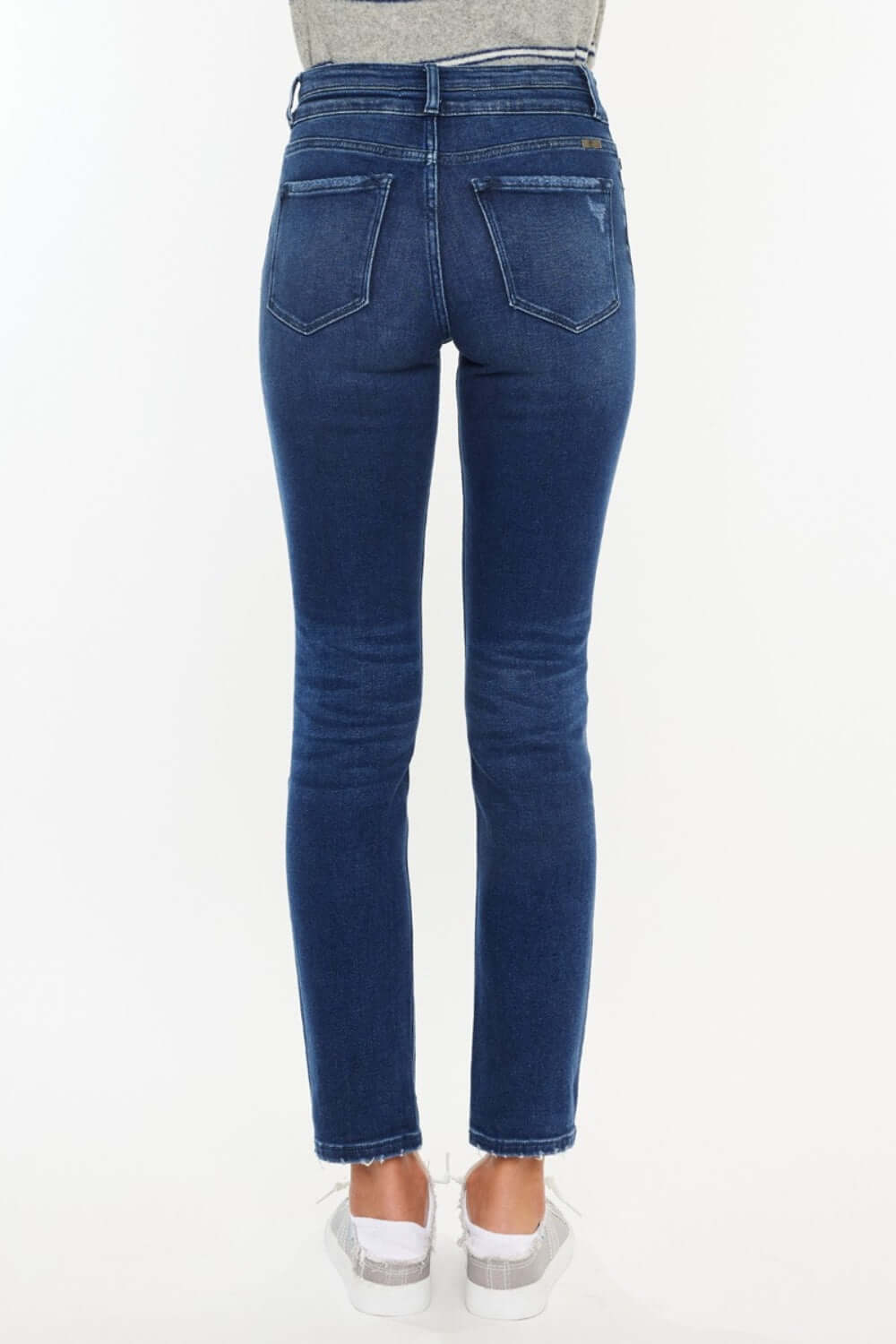 Back view of High Rise Slim Straight Jeans in dark denim, showcasing a flattering high-rise fit and slim straight leg design.