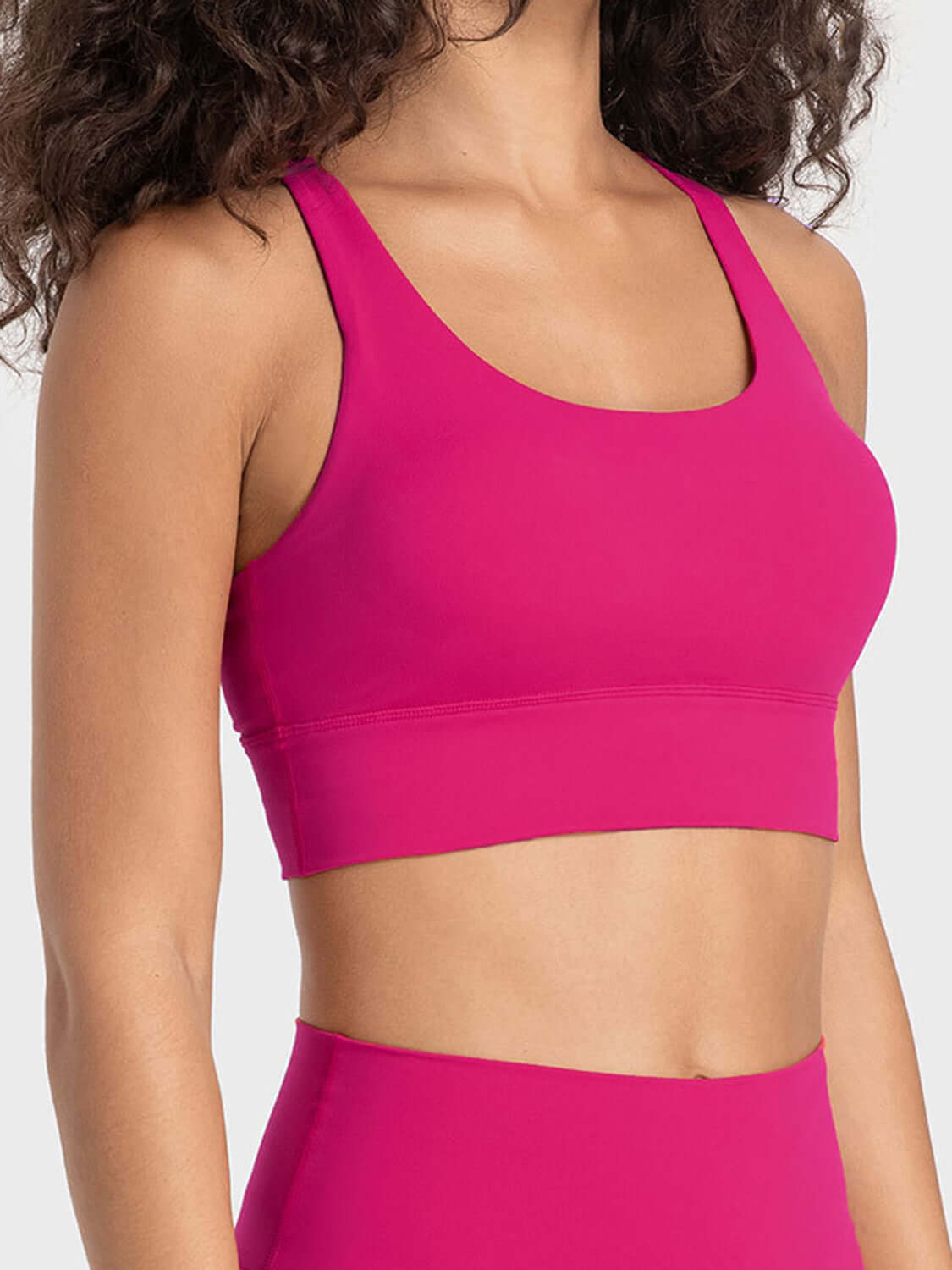 Bright pink active tank top with scoop neck and wide straps, perfect for workouts and stylish comfort.