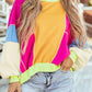 Woman wearing Bella Road Color Block Round Neck Long Sleeve Top with pocketed sheer design, paired with denim shorts.