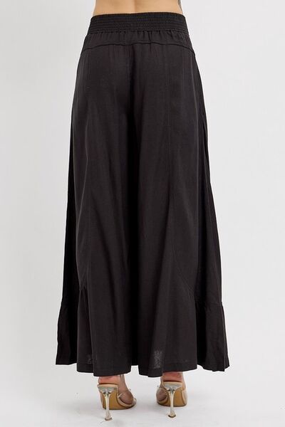 Back view of RISEN Shirring Detail Wide Leg Pants showcasing their flowy silhouette and stylish shirring details.