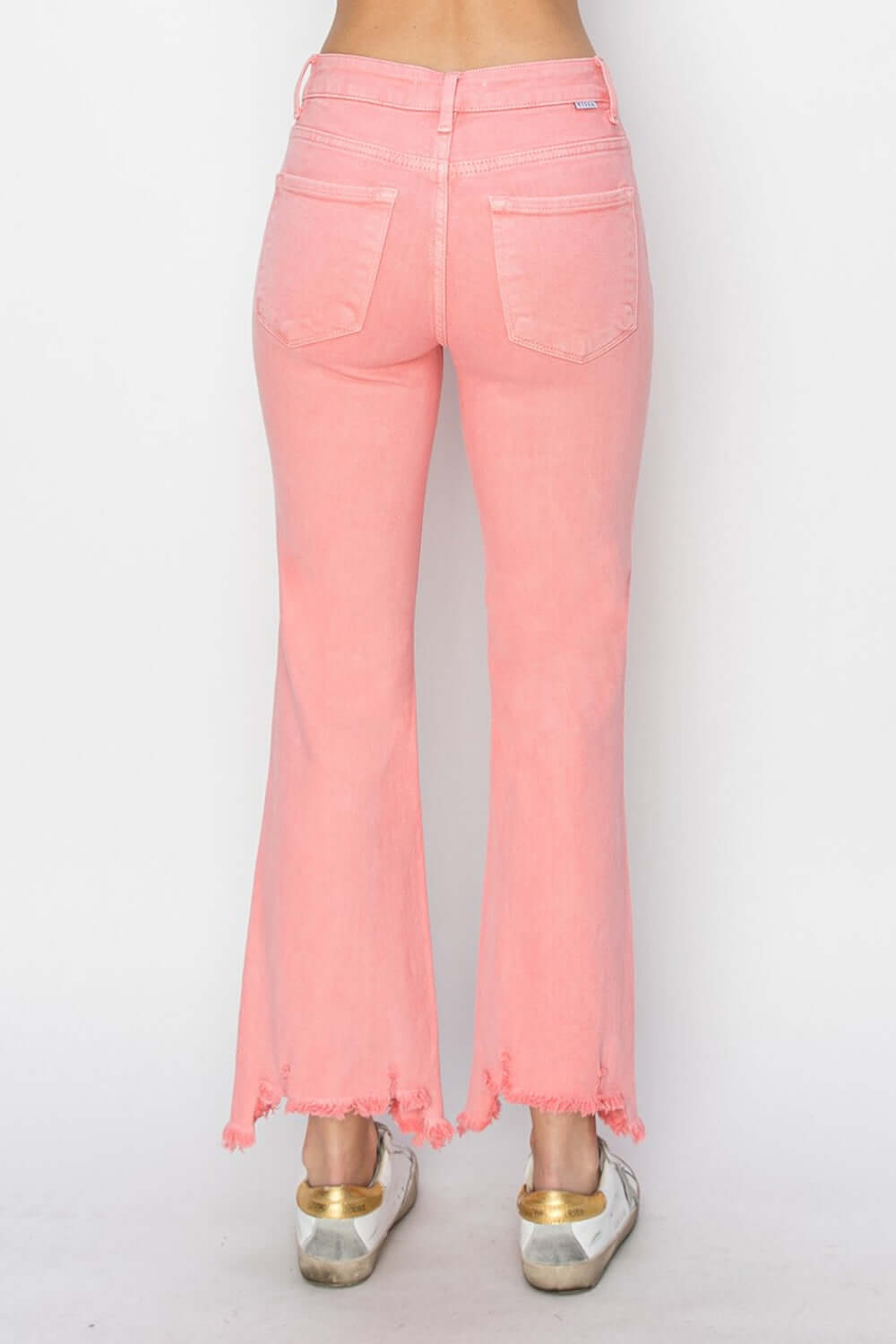 Risen Jeans - Pink Raw Hem Bootcut Jeans with Pockets. Trendy, stylish, and modern denim perfect for casual and dressy looks.