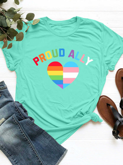 Aqua round neck short sleeve t-shirt with "Proud Ally" text and heart design, paired with jeans and sandals on a white background.