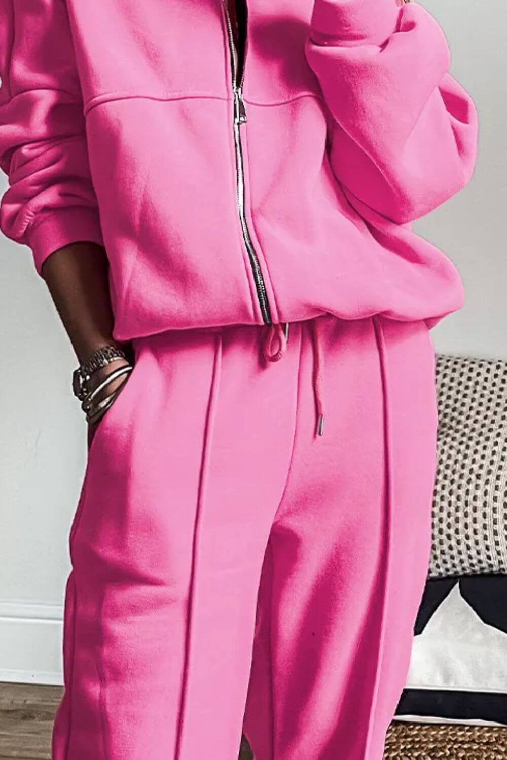 Bella Road zip up long sleeve top and pants set in vibrant pink, perfect for chic and confident style.