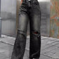 Woman wearing Bella Road Distressed Wide Leg Jeans with Pockets, styled for a casual look.