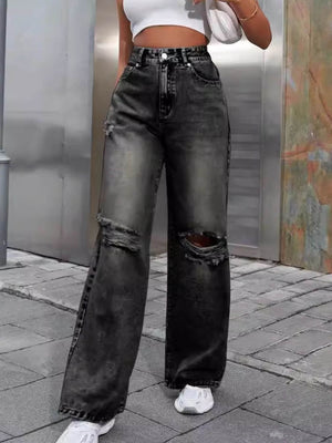 Woman wearing Bella Road Distressed Wide Leg Jeans with Pockets, styled for a casual look.