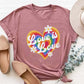 Graphic round neck short sleeve t-shirt with "Love is Love" rainbow heart design. Opaque, slightly stretchy polyester material.