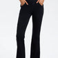 Model showcasing Basic Bae Pocketed Highly Stretchy Bootcut Jeans in black, highlighting comfort and style with pockets.