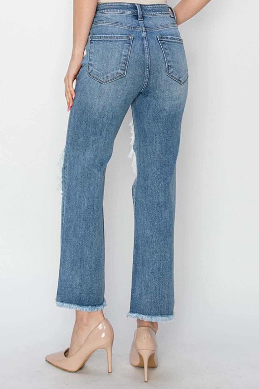 Back view of Risen Jeans high rise distressed crop straight jeans with edgy detailing and flattering fit, perfect for showcasing shoes.