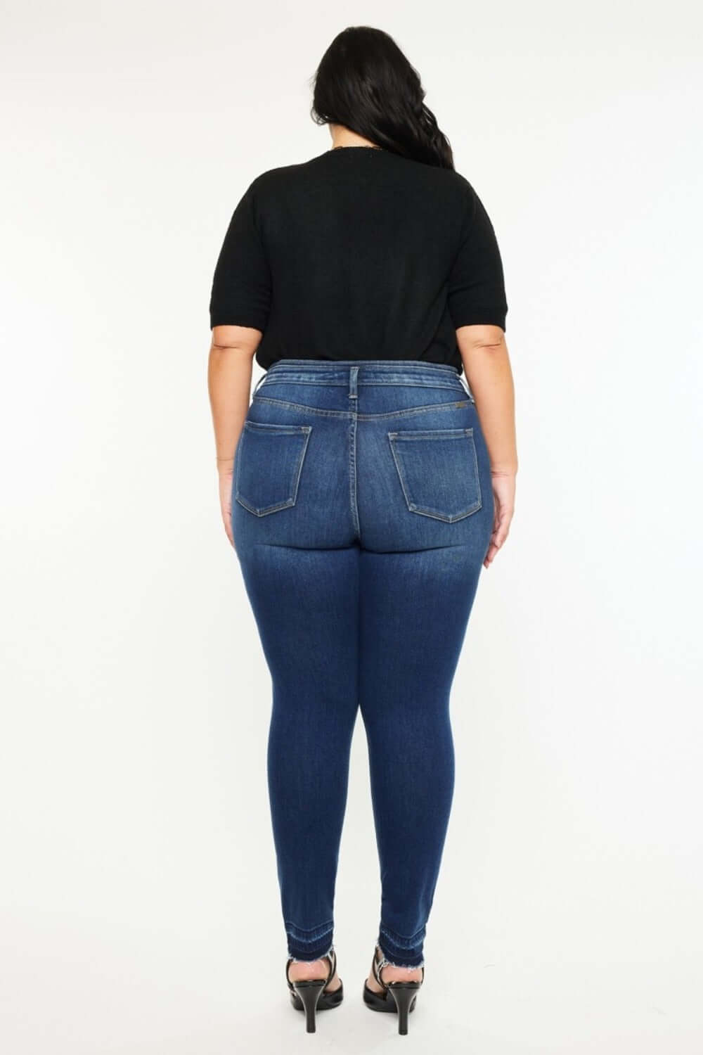 Stylish Kancan high-rise ankle skinny jeans with a unique double waistband and release hem, offering a trendy and comfortable fit.