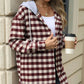 Woman wearing Bella Road Drawstring Plaid Long Sleeve Hooded Jacket holding a coffee cup.