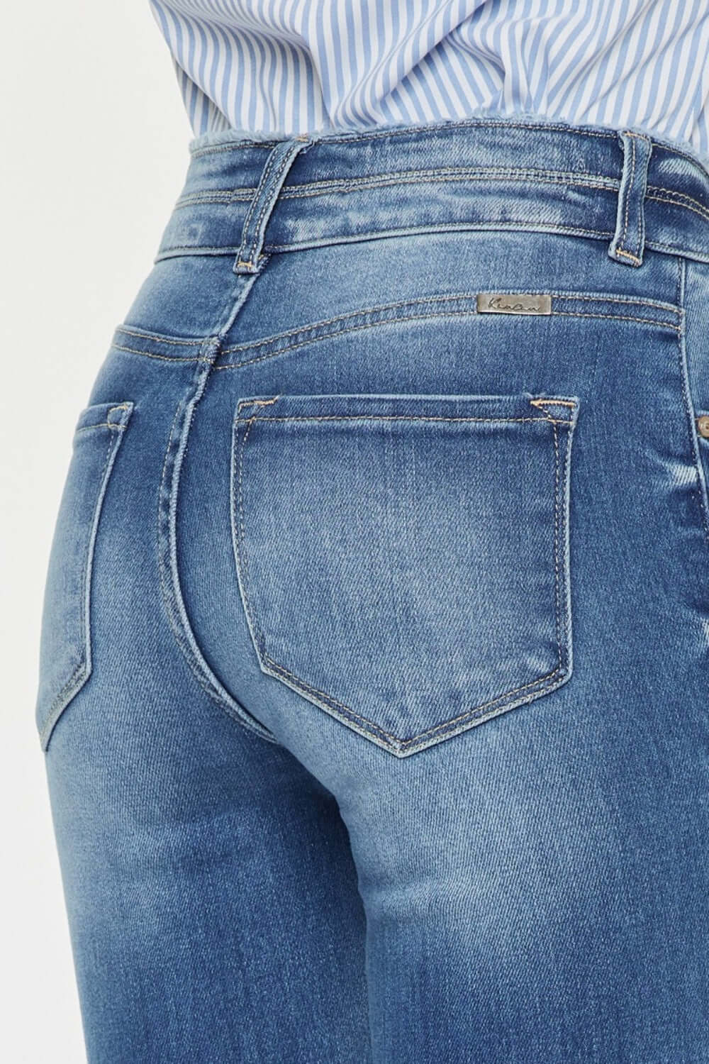 Close-up view of Distressed Raw Hem High Waist Jeans from behind showing distressed details and casual raw hem.