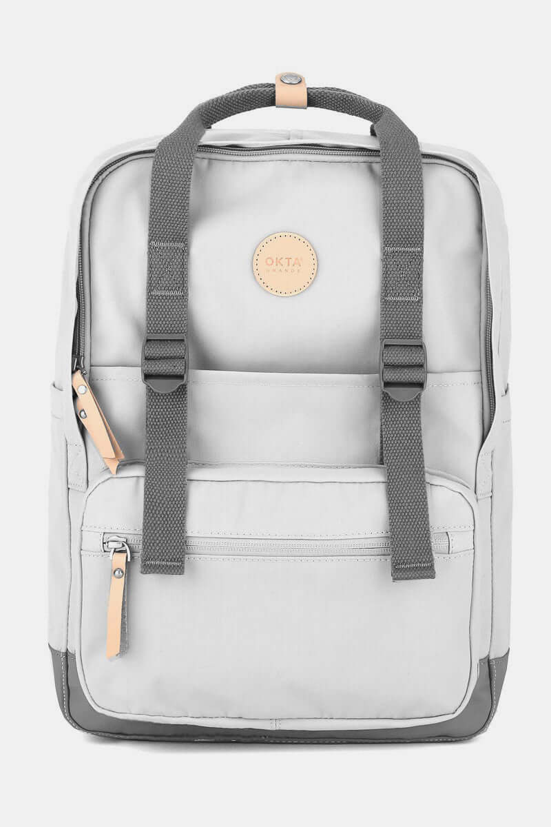 Stylish waterproof canvas backpack with side pockets, perfect for city adventures or hikes. Durable and practical design.