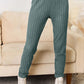 Ribbed green pants from a Notched Long Sleeve Top and Pants Set, slightly stretchy with a basic style.