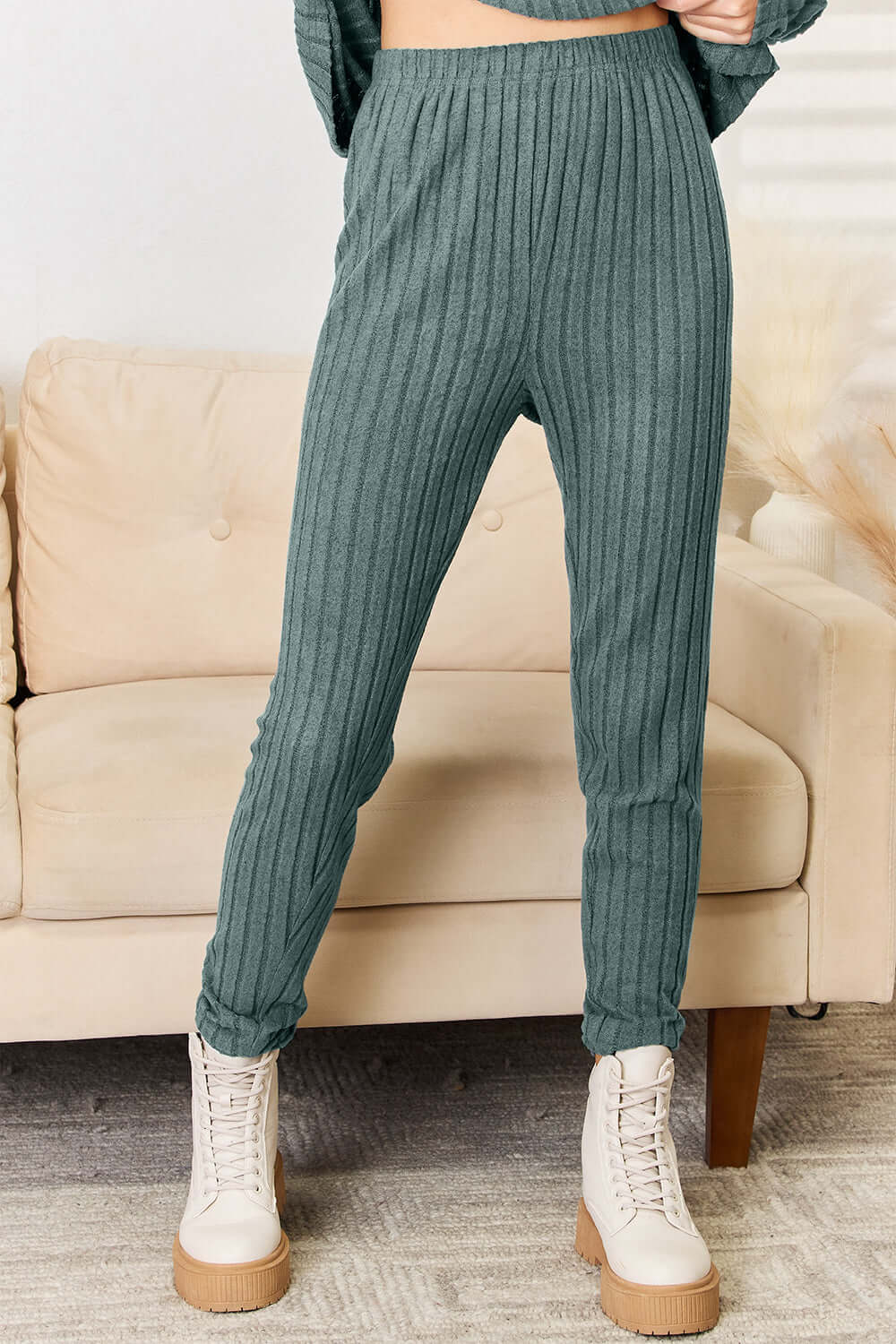 Ribbed green pants from a Notched Long Sleeve Top and Pants Set, slightly stretchy with a basic style.