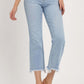 High-rise raw edge crop jeans with a raw hem, light wash, and slightly stretchy fit, perfect for a contemporary look.