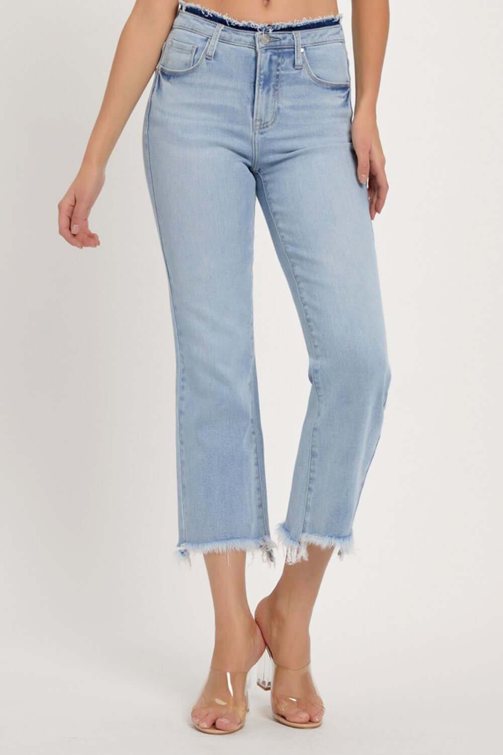 High-rise raw edge crop jeans with a raw hem, light wash, and slightly stretchy fit, perfect for a contemporary look.