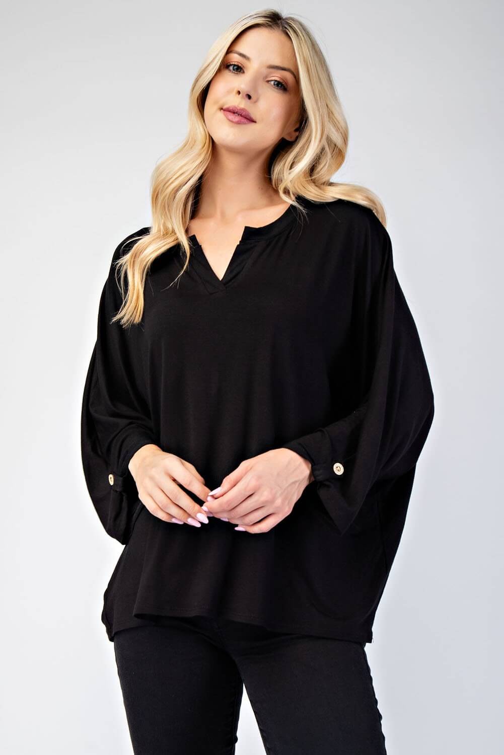 Celeste full size notched three-quarter sleeve blouse in black, featuring a chic neckline and stylish fit for versatile looks.