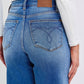 Back view of Judy Blue distressed high waist wide leg jeans, showcasing stylish denim design and pocket detailing.