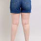 Back view of Judy Blue plus size denim shorts featuring a double button waistband and flattering high-waisted fit.