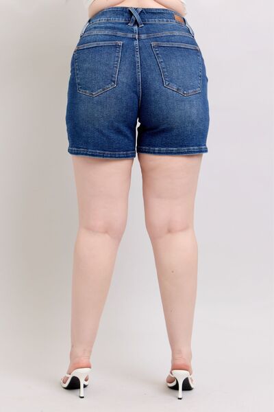 Back view of Judy Blue plus size denim shorts featuring a double button waistband and flattering high-waisted fit.