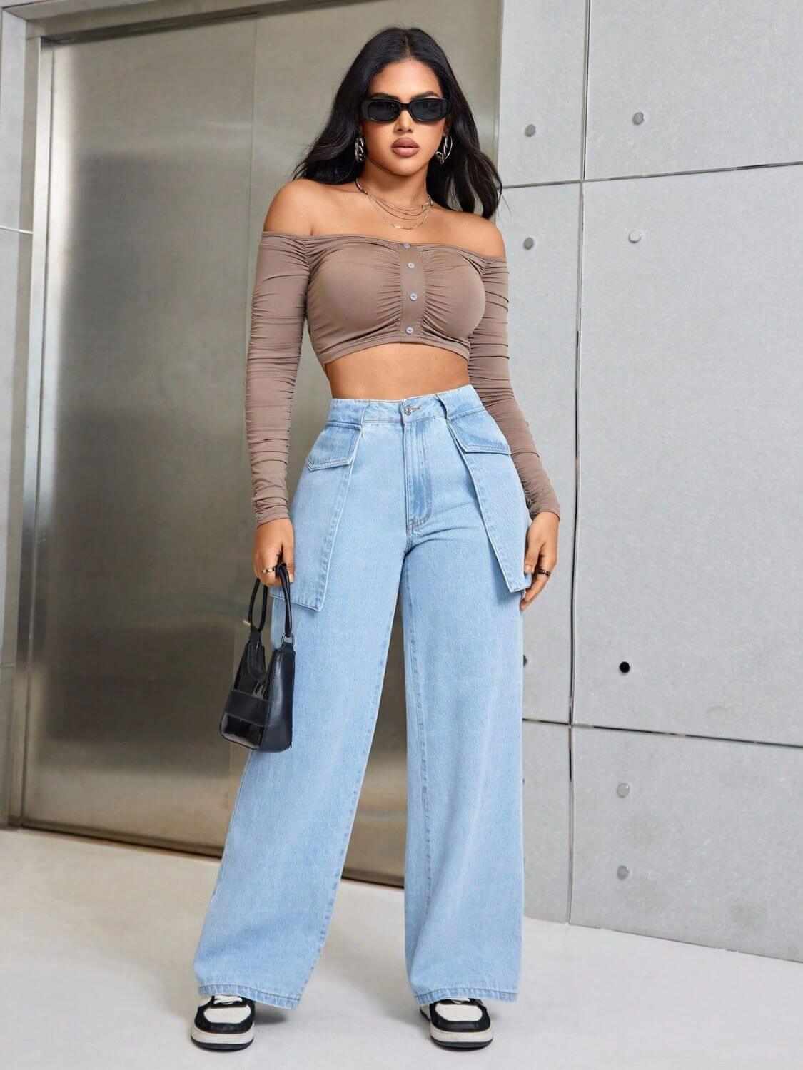 Woman wearing Bella Road Wide Leg Jeans with Pockets, styled with off-shoulder top and sunglasses, posing confidently indoors