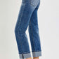 Woman wearing RISEN Full Size High Rise Crop Straight Roll Up Jeans, showcasing a stylish rolled hem and flattering fit.