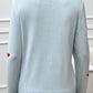 Back view of Devine Lace Detail Heart Long Sleeve Sweater in light blue with heart design on elbow patches.