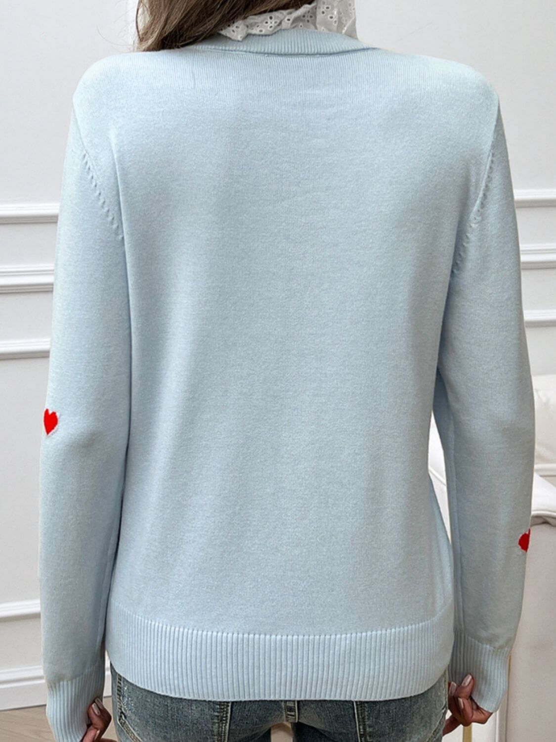 Back view of Devine Lace Detail Heart Long Sleeve Sweater in light blue with heart design on elbow patches.