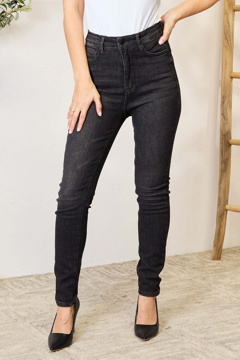 Tummy control high waist denim jeans full size model wearing Judy Blue Jeans with a sleek and flattering silhouette