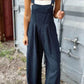 Woman wearing Bella Road plaid wide strap, wide leg overalls, perfect for stylish adventures.