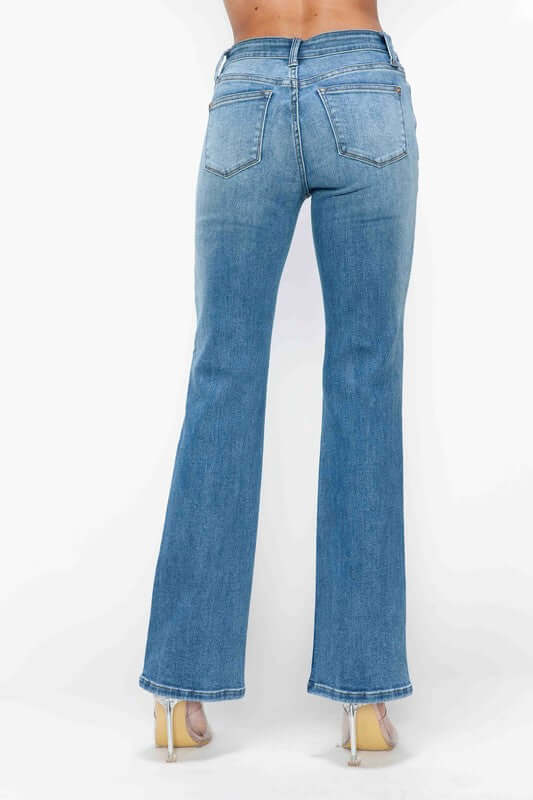 Back view of bytos Cat's Whiskers Mid Rise Bootcut Jeans, showcasing flattering fit and stylish bootcut design in light blue denim.