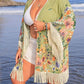 Bella Road Swim Plus Size Fringe Open Front Cover-Up with floral design by the beach, perfect for stylish summer looks.