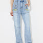 "Bella Road No Bad Days Flower High Rise Straight Leg Jeans with Pockets, stylish denim with positive embroidered design"