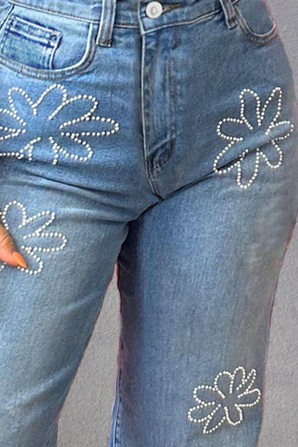 Close-up of Rhinestone Straight Jeans with flower patterns and pockets, made from cotton-polyester blend, showcasing stylish embellishments.