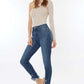 Woman modeling Raw Hem High Waist Cropped Jeans with a trendy, modern look and flattering silhouette, perfect with various tops