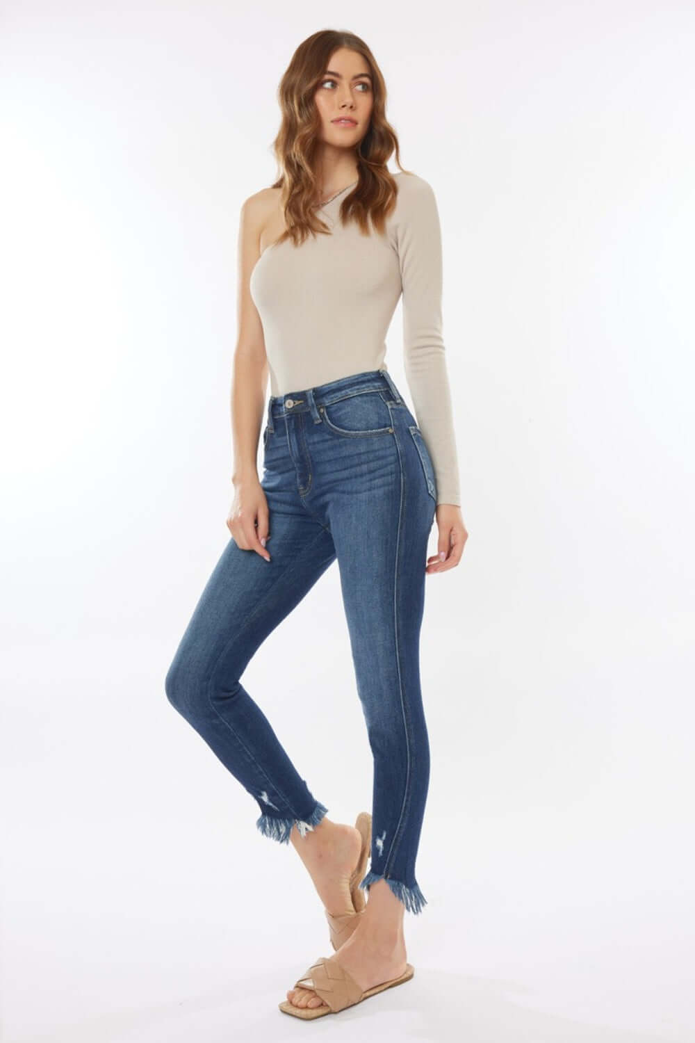 Woman modeling Raw Hem High Waist Cropped Jeans with a trendy, modern look and flattering silhouette, perfect with various tops