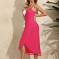 Woman wearing a vibrant pink backless tassel surplice spaghetti strap cover up dress made of 100% polyester.