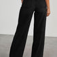 Back view of Bella Road raw hem wide leg jeans with pockets in black, no stretch.