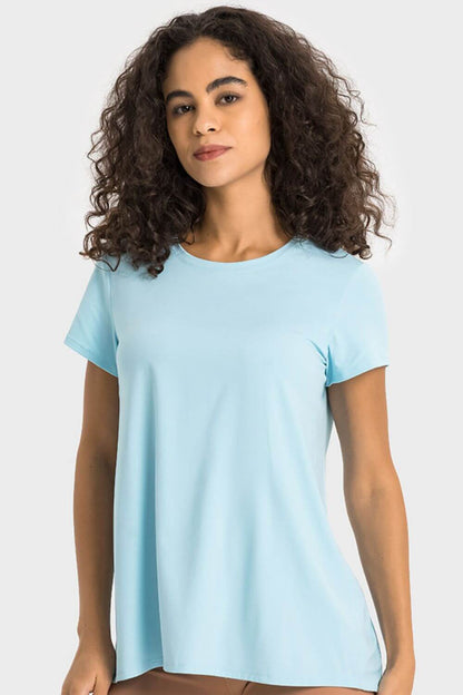 Light blue Millennia Tie Back Short Sleeve Sports Tee, perfect for fitness and fashion-forward activewear.