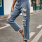 Woman wearing Bella Road Distressed Raw Hem Jeans with Pockets, slightly stretchy denim with ripped details, styled on city street.