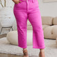 Woman wearing Crop Chloe Full Size Tummy Control High Waist Raw Hem Jeans in pink from RFM Jeans.