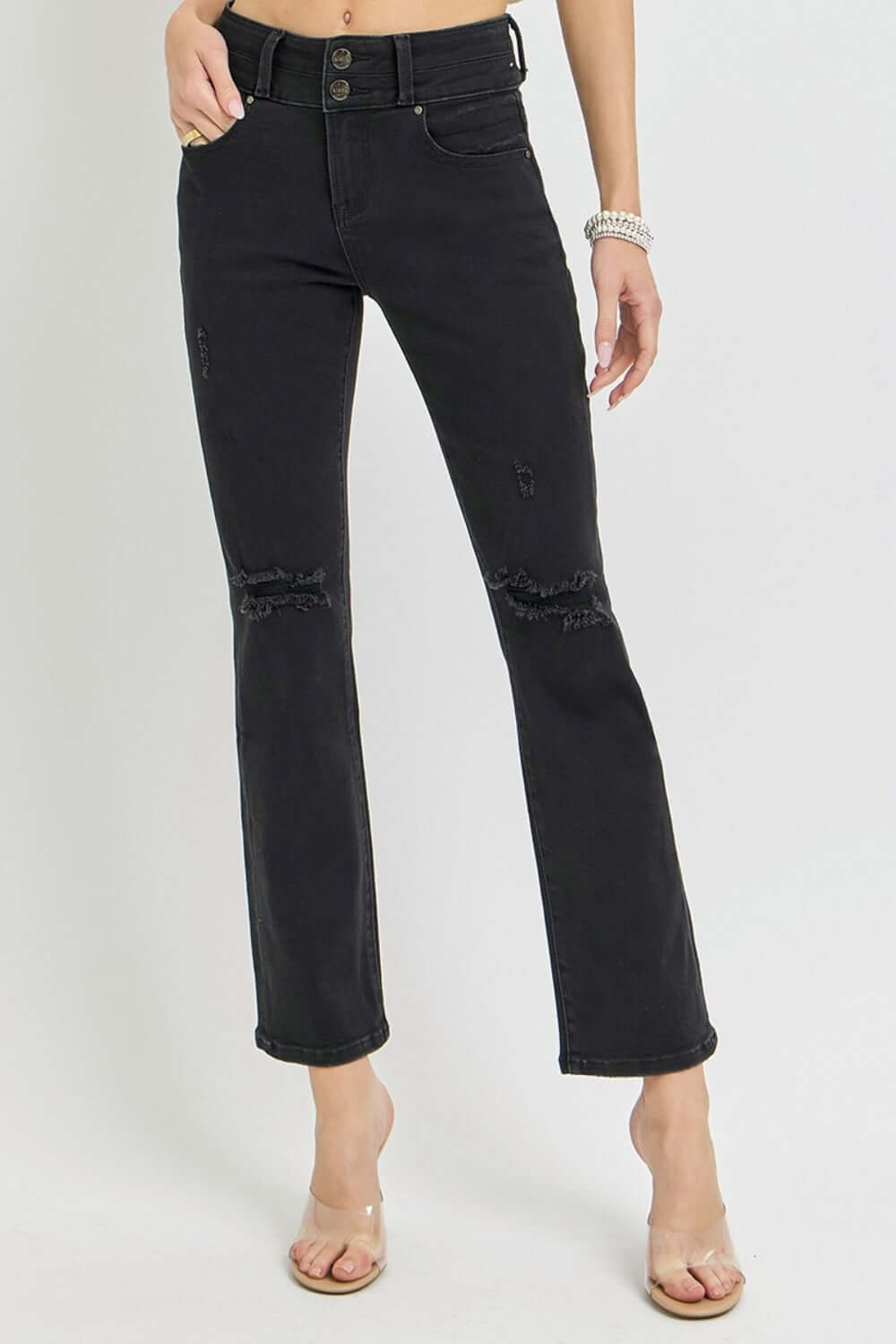 High-rise black bootcut jeans with wide waistband and ankle-length fit